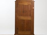 an old wooden cabinet with a door on top of it