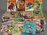 many children ' s comic books are arranged on a table