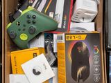 a cardboard box filled with electronic gadgets and other items