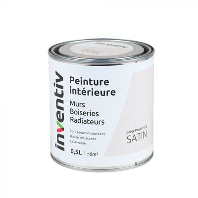 le pot de peinture est posé sur une surface blanche