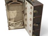 an open suitcase that is sitting on a white surface