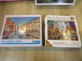 three puzzles are sitting on a table next to each other