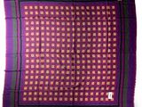 a close up of a purple and red square scarf on a white background