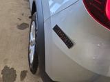 a close up of a car with a sticker on it ' s bumper