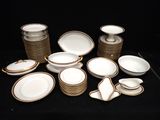 a lot of plates and bowls on a black table