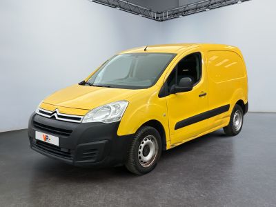 yellow citrole van parked in a white room with a black floor