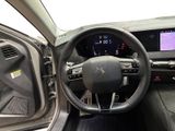 the interior of a car with a steering wheel and dashboard controls