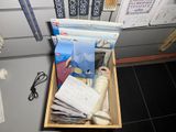 a wooden box filled with various items on a table