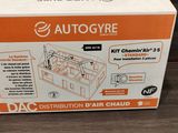an orange and white box with a picture of an autoglyre on it