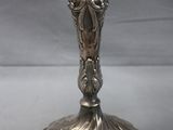 silver plated candelabra with two arms and a bird on top