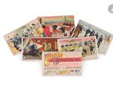 a lot of old postcards sitting on a white surface