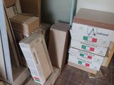 several boxes of pizza are stacked on top of each other on the floor