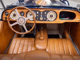 a brown leather car with a steering wheel and dashboard