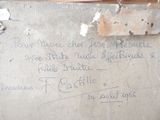 a message written on a piece of cardboard on the wall