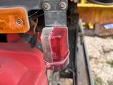 a close up view of the rear end of a red truck