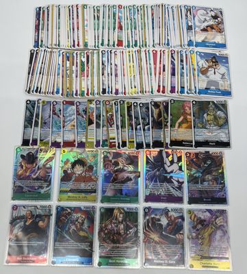 a large collection of pokemon trading cards are displayed on a table