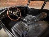 a black car with leather seats and a steering wheel