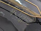 a metal comb that has been placed on top of a piece of metal