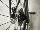 a close up of a bicycle wheel with a chain attached to it