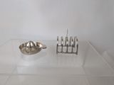 a glass display case with a spoon and a bowl on it