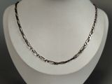 silver plated chain necklace on a mannequin display