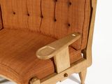 a wooden chair that has a seat made of wood