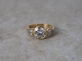 a picture of a diamond ring on a marble surface