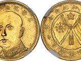 a close up of a gold coin with a man ' s face on it