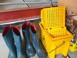 a yellow bucket and some rubber boots next to a yellow mop and a yellow bucket