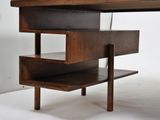 a wooden desk with three drawers on it