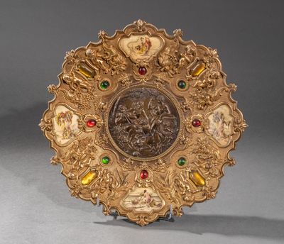 a gold plate with a picture of a man and a woman on it