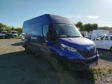 a blue van that is parked in a parking lot