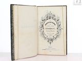 a book opened to show a picture of an old book