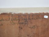 a wooden box with writing on it that has been vandalized