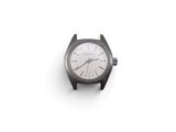 a black watch with a white face on a white surface