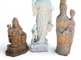 three figurines of a woman, a man and a child