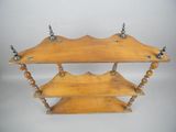 a wooden shelf that has two shelves on it