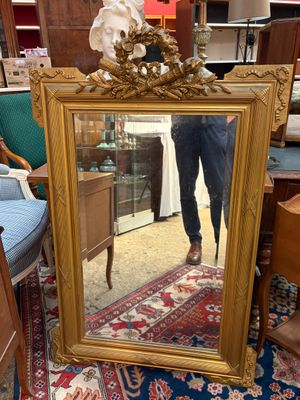 a woman taking a picture of herself in a mirror