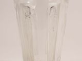 a clear glass cup with two angels on it