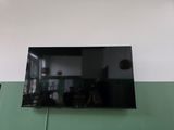 a flat screen tv mounted on the wall in the living room