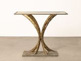 a close up of a table with a glass top on a cement floor