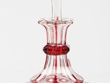 red and clear glass decanter on white background with white background