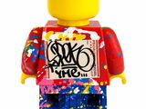a lego man with a sign on it ' s chest