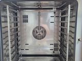 an image of a stainless steel oven inside of a building