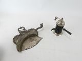 pair of silver plated figurines of a leaf and a pepper shaker