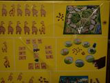 a picture of a yellow refrigerator with pictures of animals on it