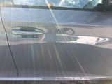 a close up of a car ' s door handle with the sun shining through the window