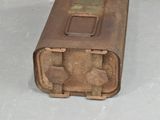 an old rusted metal box sitting on the floor