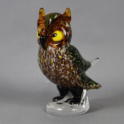 an image of a glass owl figurine on a clear base