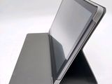 a tablet that is sitting on top of a stand